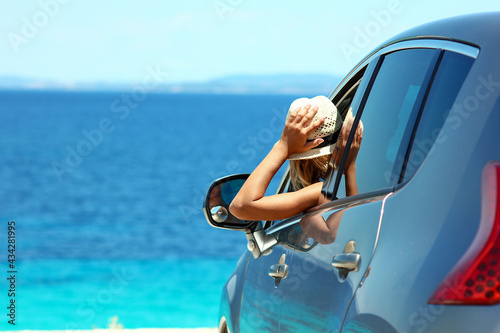 driver in car at sea in summer