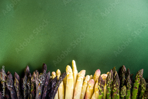 Fresh raw organic asparagus bunch, purple, green and white vegetable 