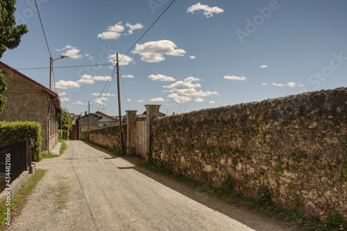 a long wall on the street in angera a town on lago maggiore, hdr image