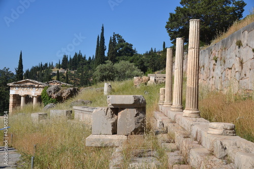 Delphi Greece with the ruins of Stoa of the Athenians on the right and the Treasury on the left