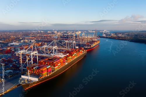 Aerial view of colorful containers on cargo ships at port of Southampton, one of UK Leading Port Terminal Operators and this container terminal is Britain's second largest deep sea termal.
