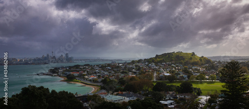 Sunset over Auckland city and North Shore on a cloudy day