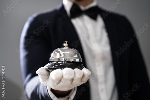 Hospitality Service Concierge In Uniforms With Butler Bell