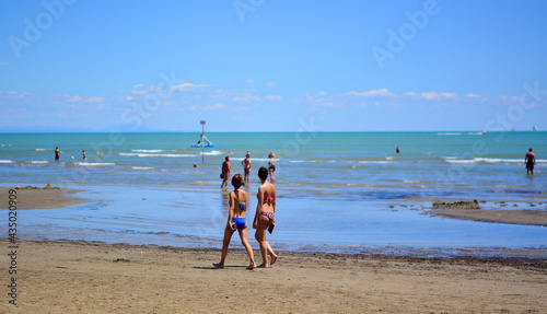 the girls stroll along the promenade