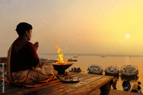 An Unidentified Hindu Brahman monk meditates on the ghat stairs of holy Ganges river