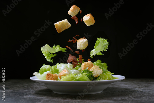 Caesar salad with crispy bread and bacon , Healthy food style