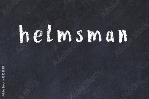 College chalk desk with the word helmsman written on in