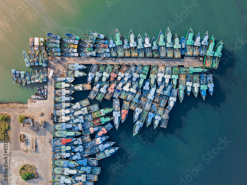 Broken bridge across the river from top view