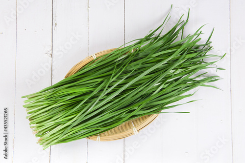 Fresh Chinese chives,Garlic chives on wooden background