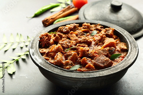 Traditional cooking- Indian mutton curry cooked in clay pot .earthen ware, pottery 