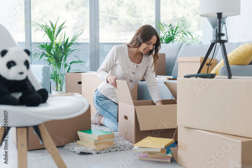 Woman unpacking in her new house