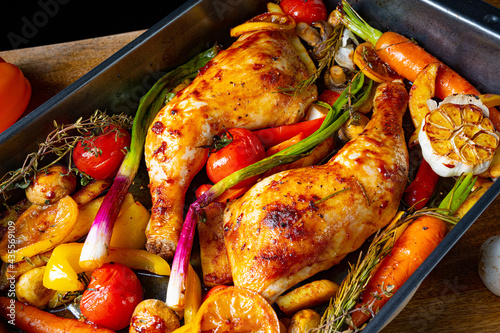 fried chicken legs with various vegetables