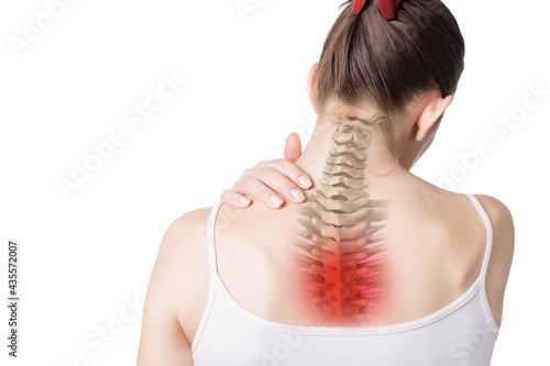 Female neck, back and trapezius muscles with upper spine inside, thoracic region marked red. Caucasian woman touches her shoulder, isolated on white.