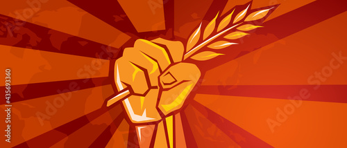 hand holding grain wheat rice crop symbol of revolution fight for prosperity food freedom victory