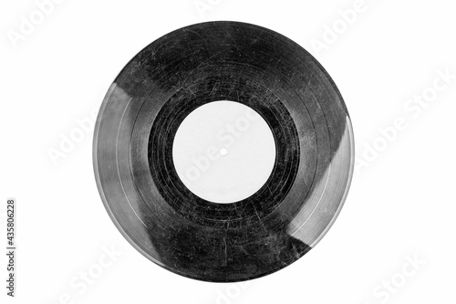 Old fashioned damaged scratched vinyl record, black and white hdr, object isolated on white background, cut out, empty blank label. Classic vintage retro vinyl disc with many deep scratches, top view