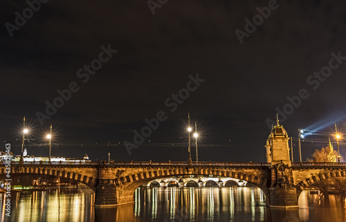 Night shot of Legion Bridge - Most Legií - over river Vltava in Prague, with Charles Bridge and Prague Castle; taken from Slovansky ostrov