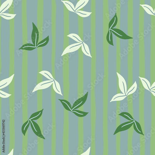 Decorative seamless pattern with doodle minimalistic leaves in green and white colors. Striped background.