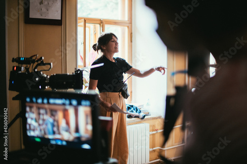 Director at work on the set. The director works with a group or with a playback while filming a movie