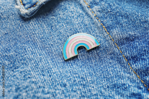 Pinned badge as symbol of transgender on clothes, closeup