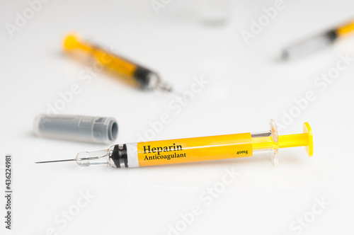 Pre filled heparin syringe on white table