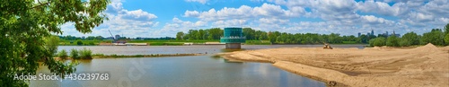 Gruba Kaska – water filtration station on the Vistula river in Warsaw. Panorama overlooking the river and sand on the shore