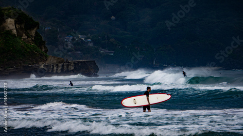 Surfers on a beach of Izu peninsula, Japan
