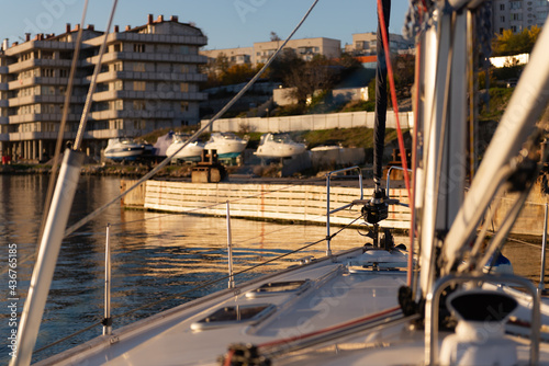 Photo from the bow of the yacht before mooring. In the evening sun, the yacht is moored. Photo from the helmsman.