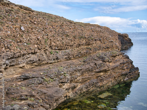 Conglomerate rock on the Ness of Burgi, south Shetland, UK - Hayes Sandstone Formation - Sedimentary Bedrock formed approximately 383 to 393 million years ago in the Devonian Period.