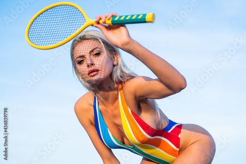 perfect body shape. badminton game racquet. sport and hobby. summer activity.