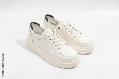 Women's white leather sneakers with thick soles