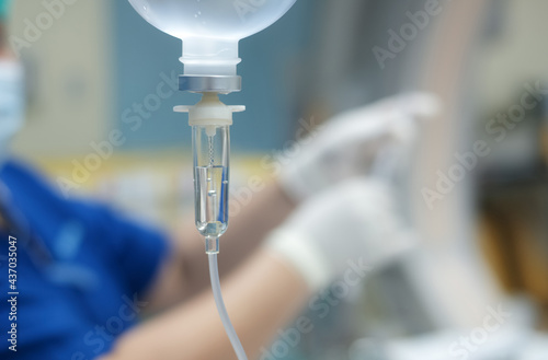 Set vitamin iv fluid intravenous drop saline drip hospital room Medical Concept treatment emergency and injection drug infusion care chemotherapy concept.blue light background selective focus