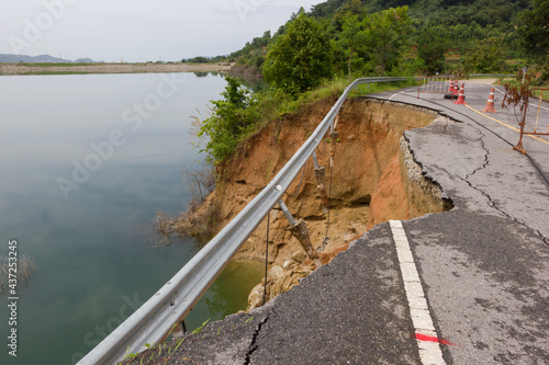 Asphalt road collapsed and cracks in the roadside, Road landslide.