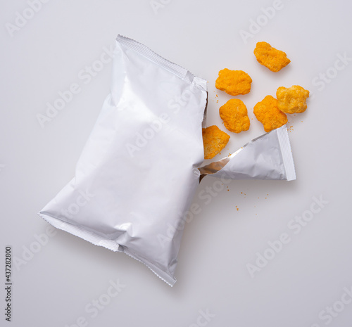 Corn puff snacks open bag packaging isolated on white background