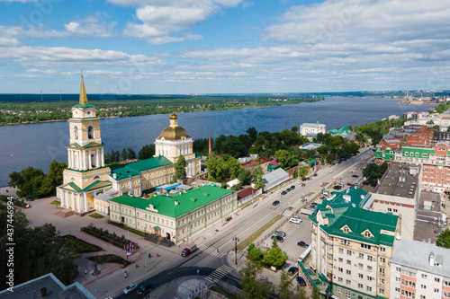 Aerial view of Perm and historical building of art gallery, Kama river with bridge in sunny summer day with green trees