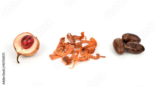 Fresh nutmeg ,dried mace and seeds isolated on white background.