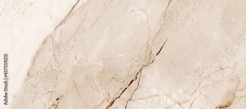 ivory-gold marble stone texture, Intertwined with dark brown streaks, Marble is a hard rock granite and applicability in modern home decor - such as ceramic wall tile exterior-interior, kitchen tile.