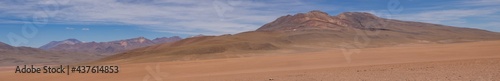 Huge panorama landscape in desert of brown and orange mountains in deserto de atacama, chile