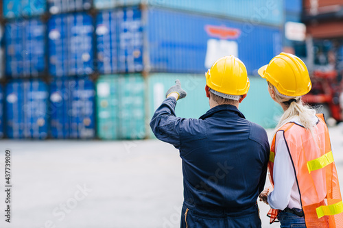 Staff director logistic shipping worker teamwork working in shipping cargo containers for export and import goods engineer people work at port yard.