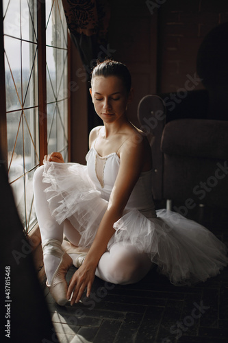 Ballerina posing in front of white background