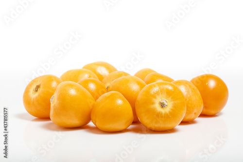 Bunch of bright yellow ripe Cape goldenberries isolated on white background