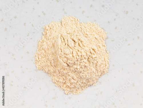 pile of apple pectin powder close up on gray