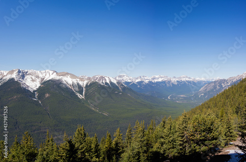 Beautiful landscape on a sunny springtime day. Rocky mountains and huge forest at Banff National Park, Alberta, Canada. America