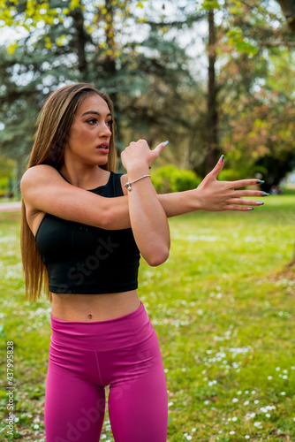Image of concentrated young sports lady make sport jog exercises
