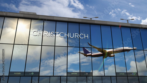 Airplane landing at Christchurch New Zealand airport mirrored in terminal