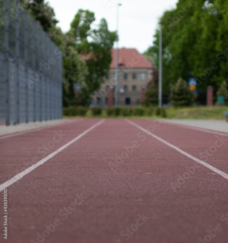 school track with a view of the city