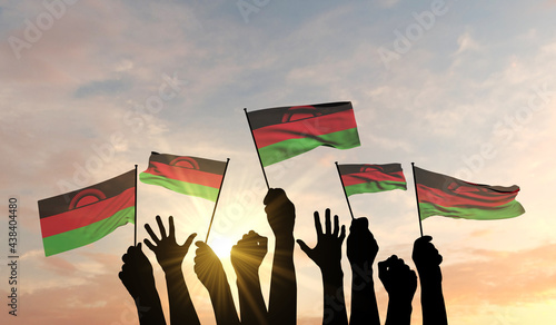 Silhouette of arms raised waving a Malawi flag with pride. 3D Rendering