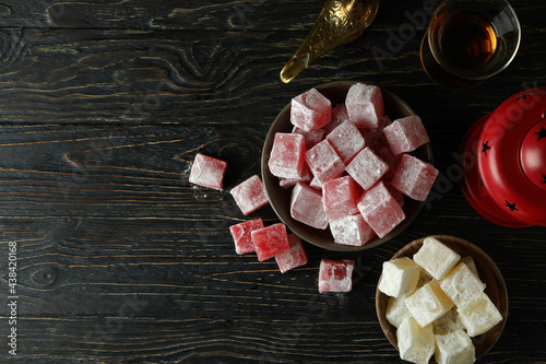 Concept of tasty food with turkish delight on wooden table