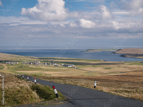 From Sother's Field, a view across Valsgarth and Clibberswick with the water of Harold's Wick, the hill of the Keen of Hamar and the island of Balta appearing on the right - Unst, Shetland, UK