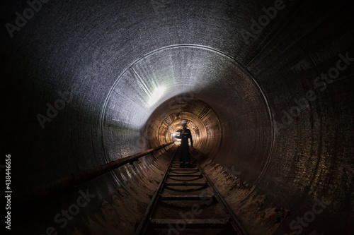 Working male inspection weld underground of equipment tunnel