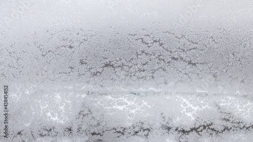 frosted home window in urban houses in winter